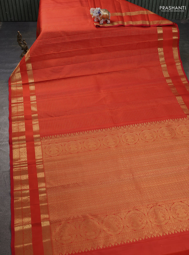 Pure kanchipuram silk saree orange with allover samll zari woven checked pattern and rettapet zari woven border