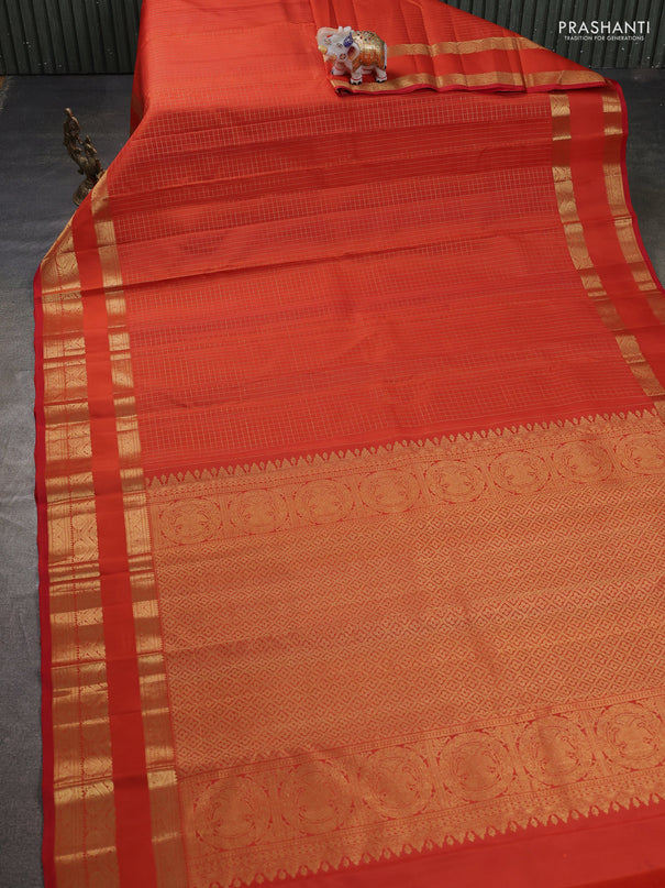 Pure kanchipuram silk saree orange with allover samll zari woven checked pattern and rettapet zari woven border
