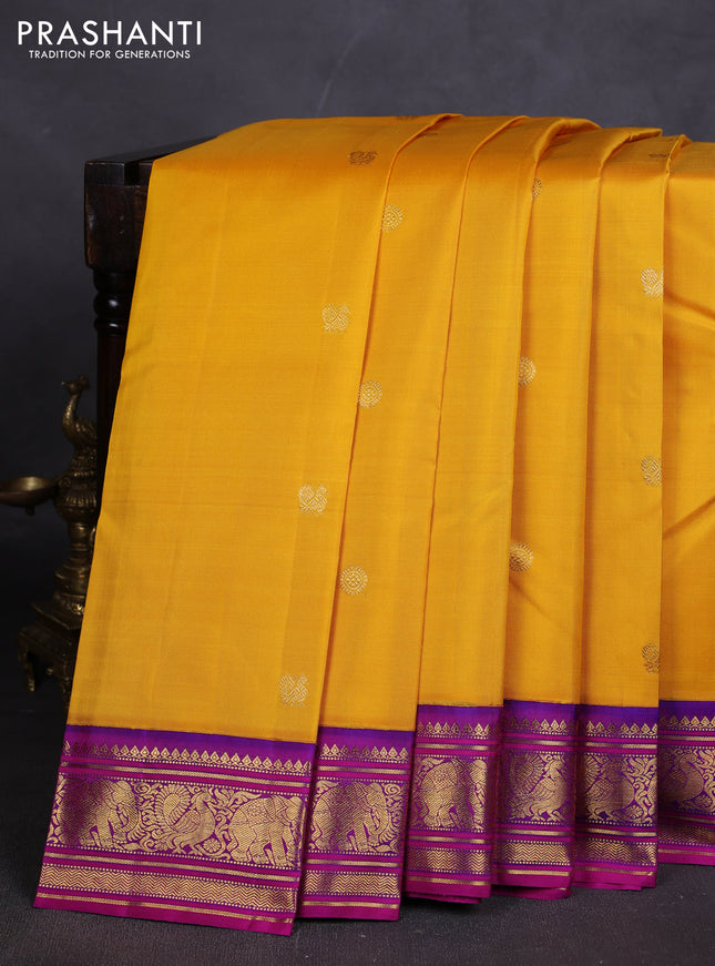 Pure kanchipuram silk saree mango yellow and purple shade with zari woven buttas and rich zari woven korvai border