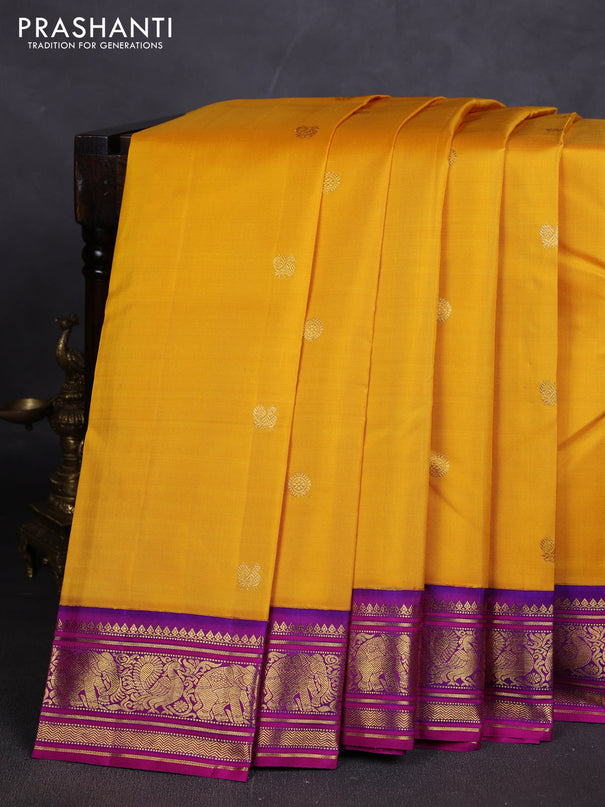 Pure kanchipuram silk saree mango yellow and purple shade with zari woven buttas and rich zari woven korvai border