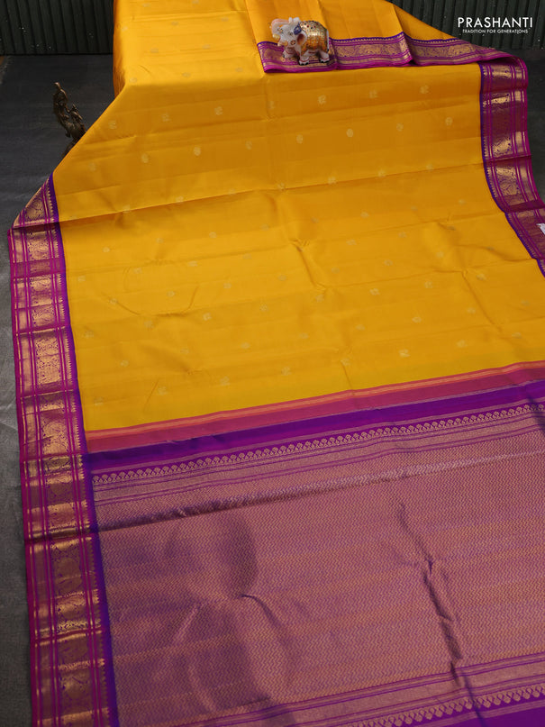 Pure kanchipuram silk saree mango yellow and purple shade with zari woven buttas and rich zari woven korvai border