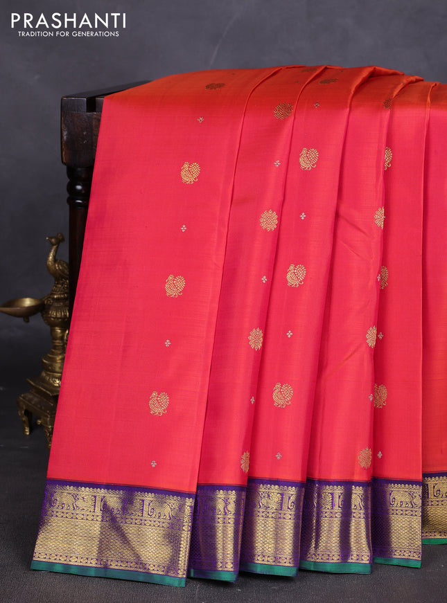 Pure kanchipuram silk saree dual shade of pinkish orange and violet with zari woven buttas and rich zari woven korvai border