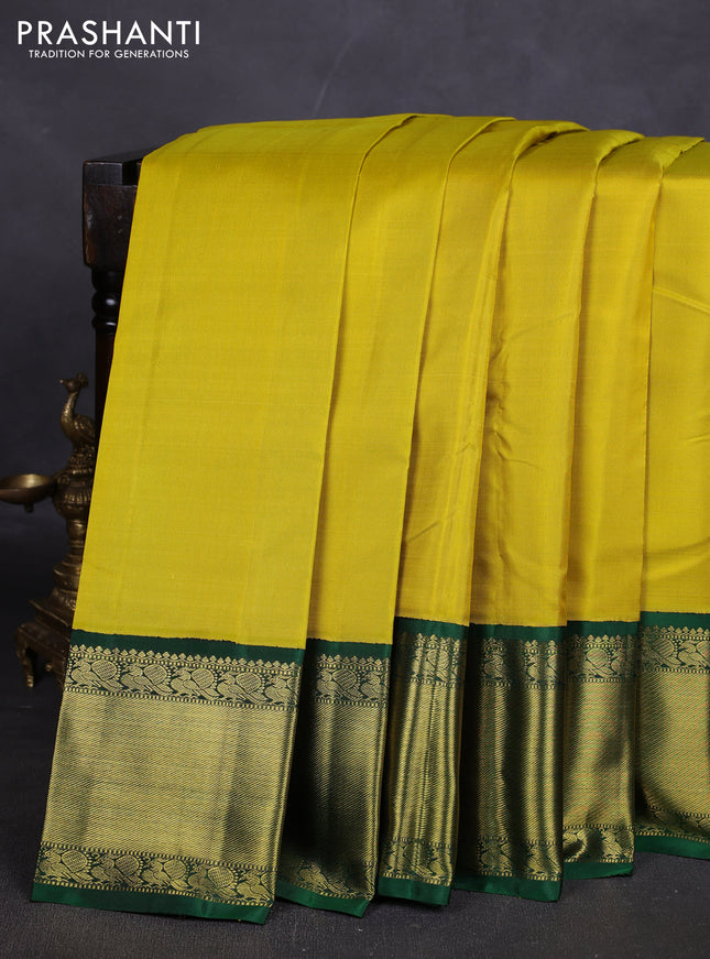 Pure kanchipuram silk saree lime yellow and green with plain body and rich zari woven korvai border