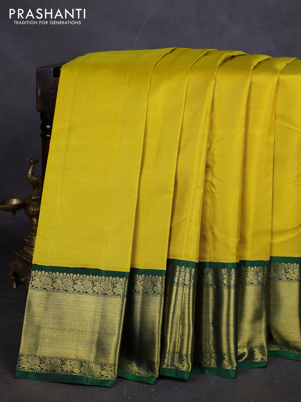 Pure kanchipuram silk saree lime yellow and green with plain body and rich zari woven korvai border