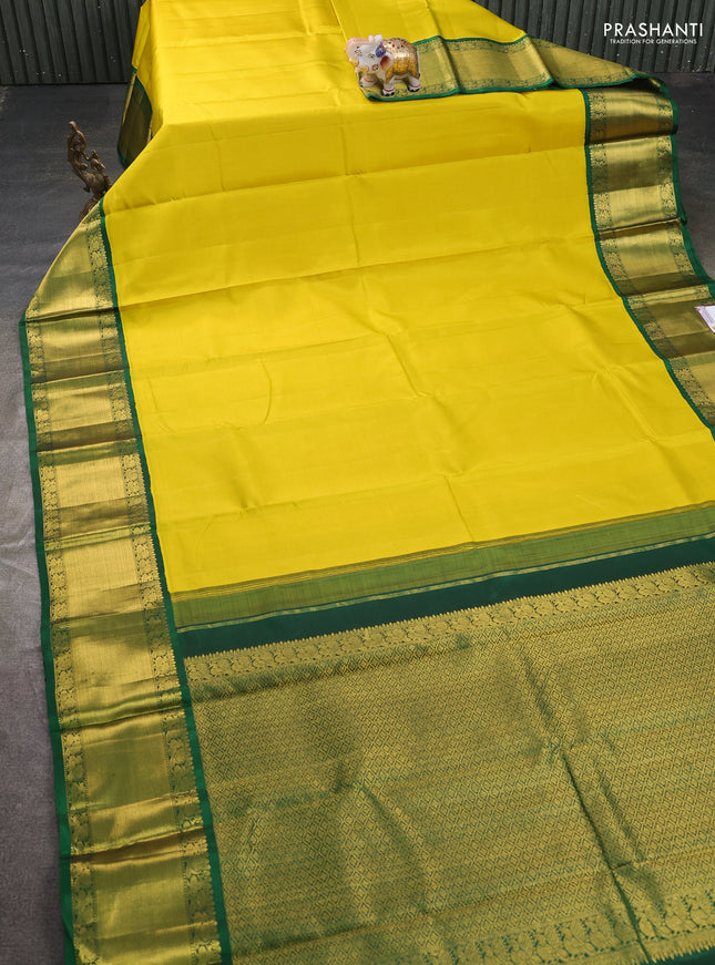 Pure kanchipuram silk saree lime yellow and green with plain body and rich zari woven korvai border