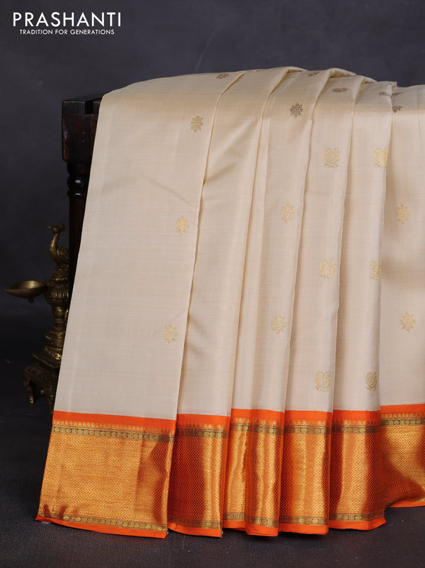 Pure kanchipuram silk saree cream and orange with zari woven buttas and rich zari woven border