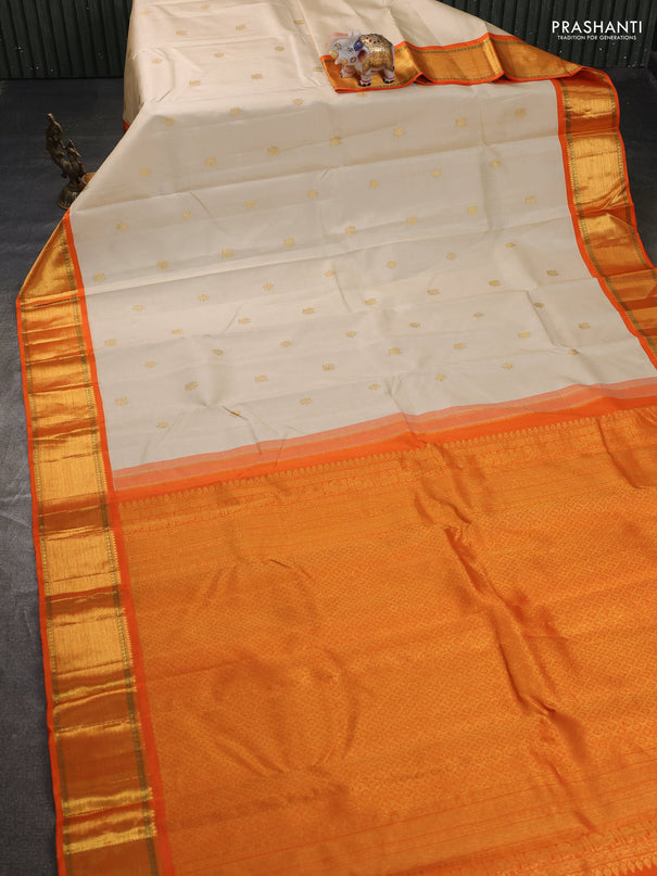Pure kanchipuram silk saree cream and orange with zari woven buttas and rich zari woven border