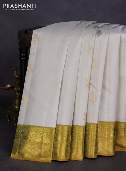 Pure kanchipuram silk saree off white and dark mustard with zari woven buttas and zari woven border