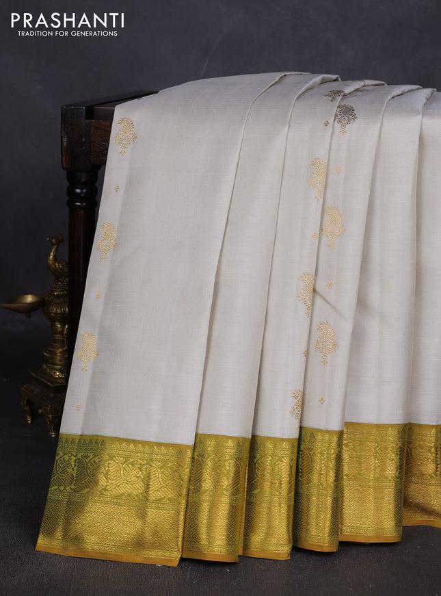 Pure kanchipuram silk saree off white and dark mustard with zari woven buttas and zari woven border