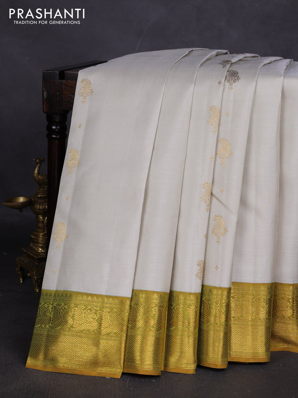 Pure kanchipuram silk saree off white and dark mustard with zari woven buttas and zari woven border