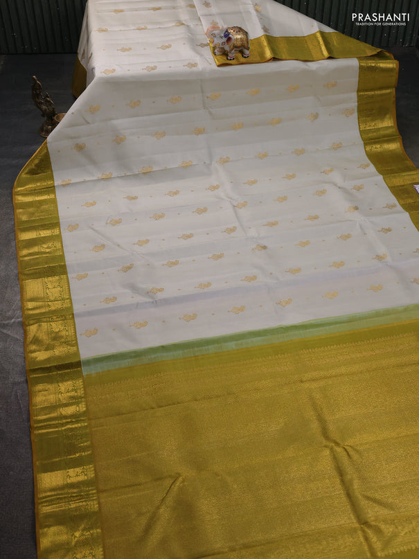 Pure kanchipuram silk saree off white and dark mustard with zari woven buttas and zari woven border