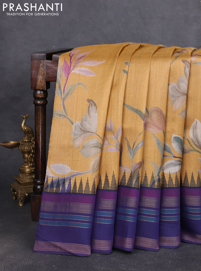 Pure tussar silk saree mustard yellow and navy blue with allover floral prints and long temple design rettapet zari woven border