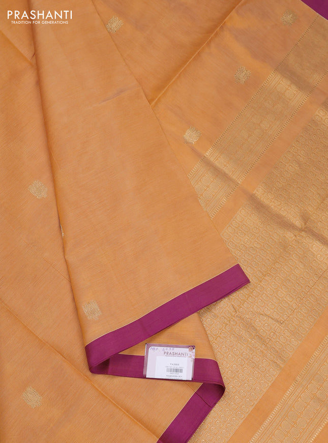 Kanchipuram silk cotton saree mustard yellow and purple with zari woven buttas and simple border