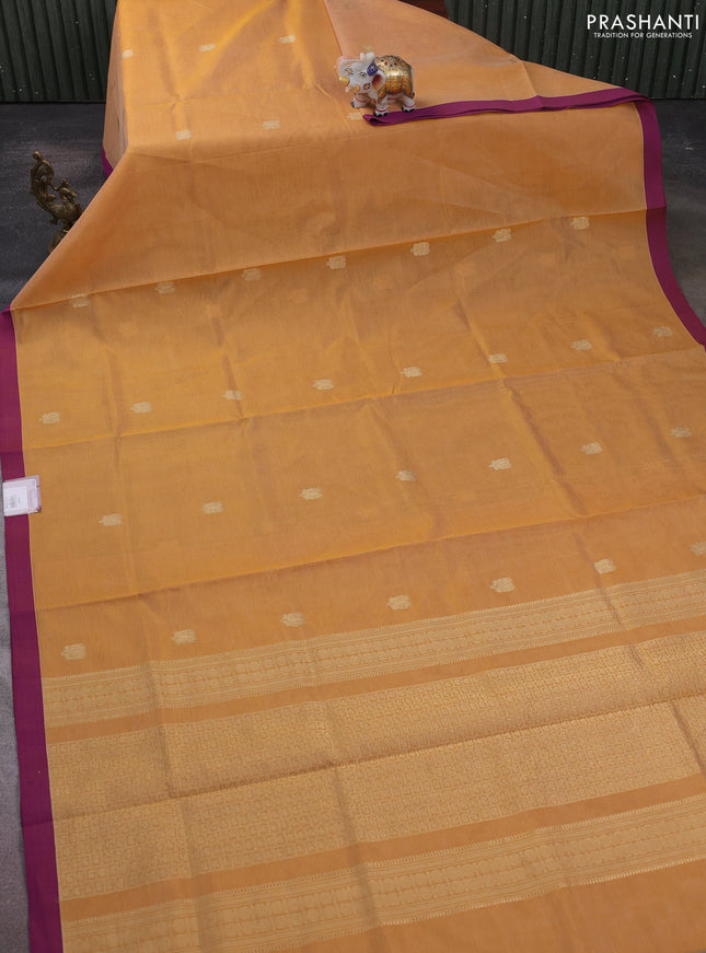 Kanchipuram silk cotton saree mustard yellow and purple with zari woven buttas and simple border