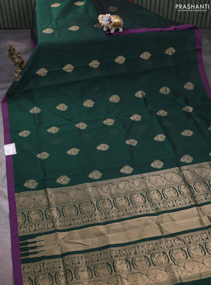 Kanchipuram silk cotton saree bottle green and purple with zari woven buttas and simple border