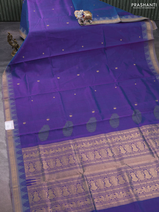 Kanchipuram silk cotton saree dual shade of greenish purple and grey with zari woven buttas and temple design zari woven border