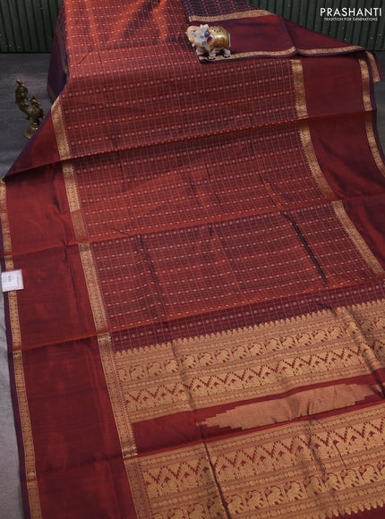 Kanchipuram silk cotton saree rust shade with allover thread checks & 1000 buttas and long rettapet zari woven border