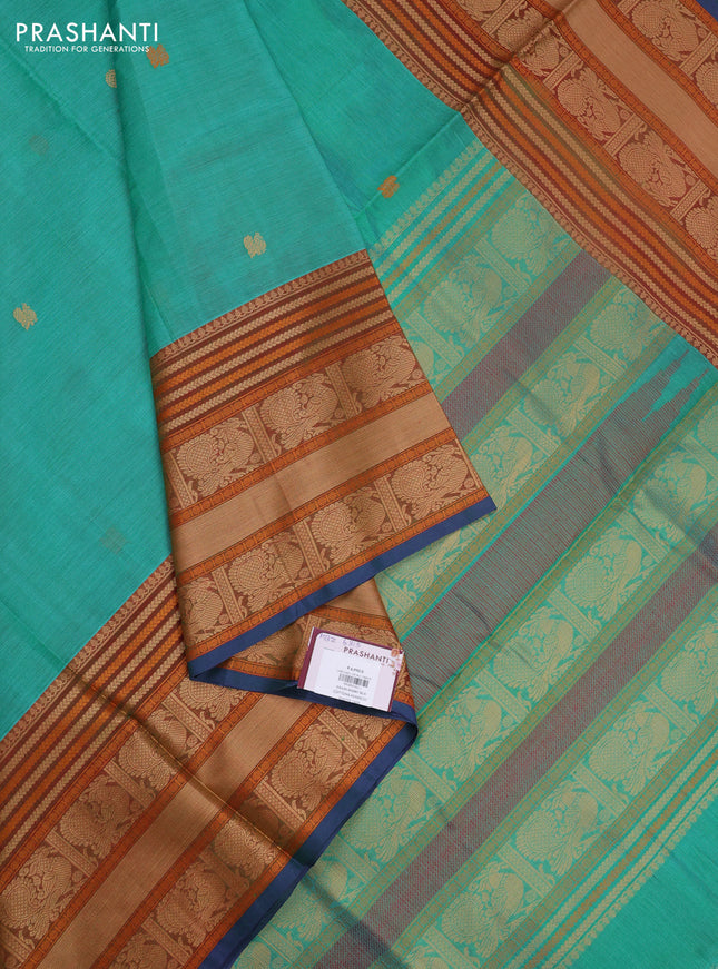 Kanchipuram silk cotton saree teal green and rust shade with zari woven buttas and long thread woven border
