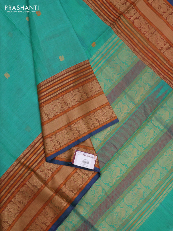 Kanchipuram silk cotton saree teal green and rust shade with zari woven buttas and long thread woven border