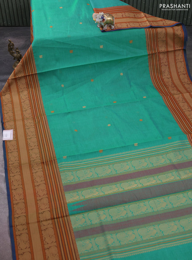 Kanchipuram silk cotton saree teal green and rust shade with zari woven buttas and long thread woven border