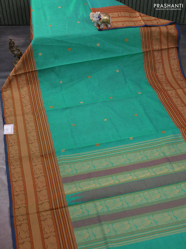 Kanchipuram silk cotton saree teal green and rust shade with zari woven buttas and long thread woven border