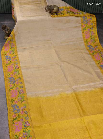 Pure soft silk saree cream and yellow with allover zari weaves and zari woven embroidery border