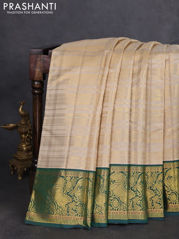 Pure kanchipuram silk saree beige and green with allover zari woven checked pattern and rich zari woven border