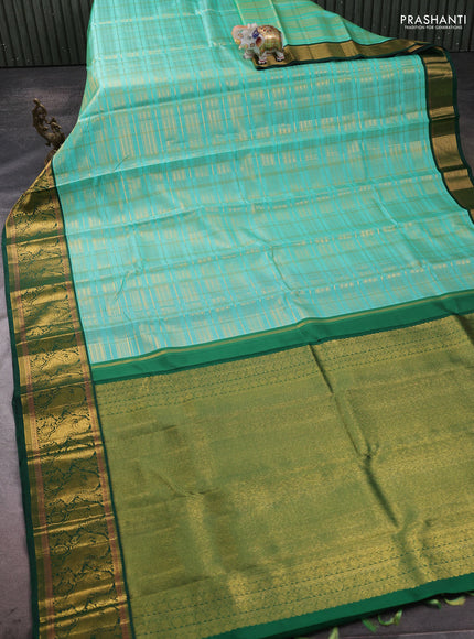 Pure kanchipuram silk saree teal shade and green with allover zari woven checked pattern and rich zari woven border
