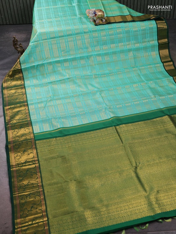Pure kanchipuram silk saree teal shade and green with allover zari woven checked pattern and rich zari woven border