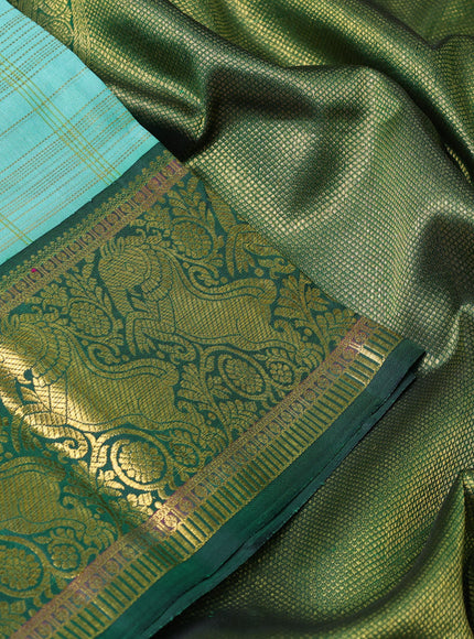 Pure kanchipuram silk saree teal shade and green with allover zari woven checked pattern and rich zari woven border