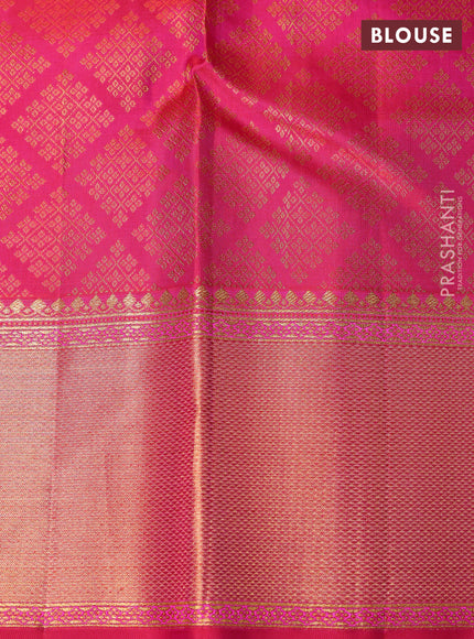 Pure kanchipuram silk saree dual shade of pinkish orange and pink with allover zari woven brocade weaves and rich zari woven border