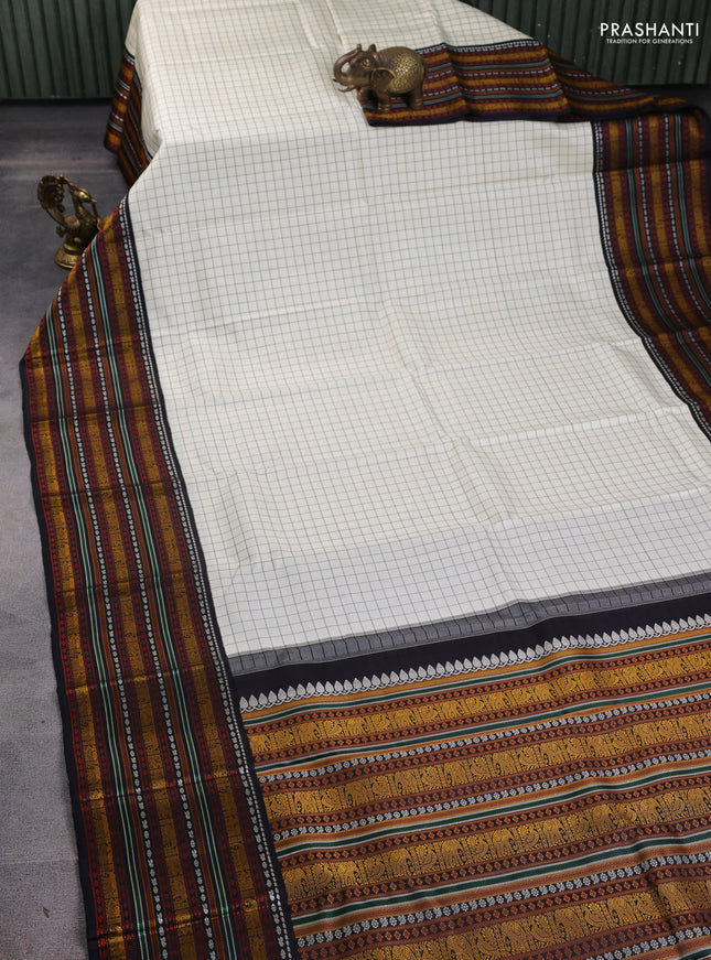 Pure kanchipuram silk saree cream and black with allover thread woven checked pattern and long thread woven korvai border