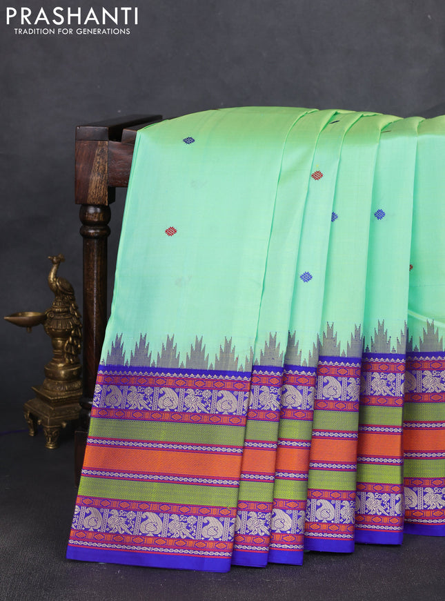 Pure kanchipuram silk saree teal green shade and royal blue with thread woven buttas and long temple design thread woven border