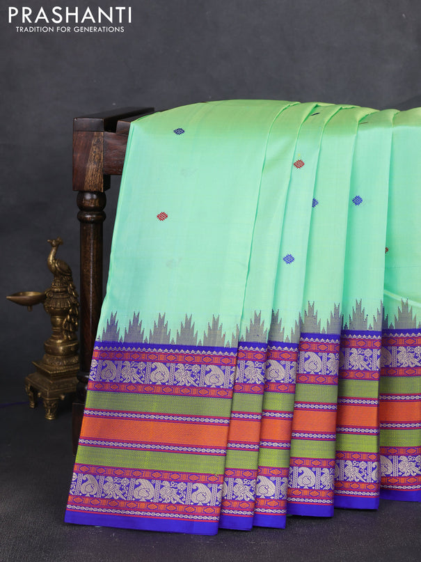 Pure kanchipuram silk saree teal green shade and royal blue with thread woven buttas and long temple design thread woven border