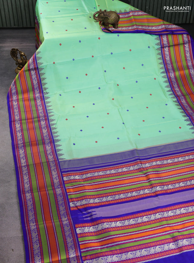 Pure kanchipuram silk saree teal green shade and royal blue with thread woven buttas and long temple design thread woven border