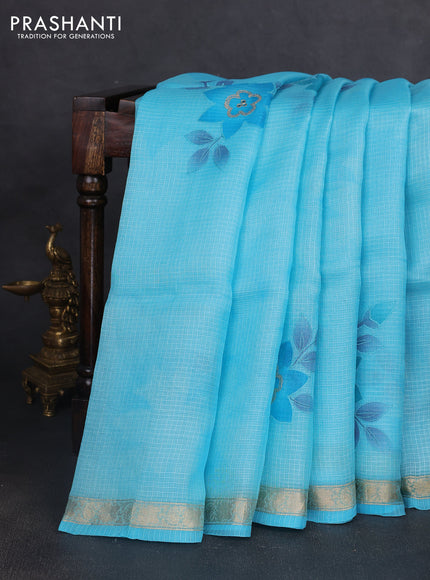 Silk kota saree light blue with floral prints & pita work and zari woven border