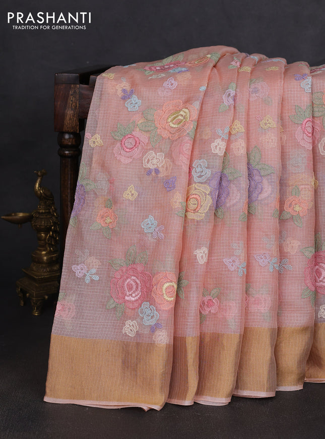 Silk kota saree peach orange with allover floral embroidery work and zari woven border