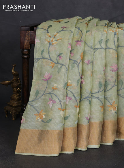 Silk kota saree pista green with allover floral embroidery work and zari woven border
