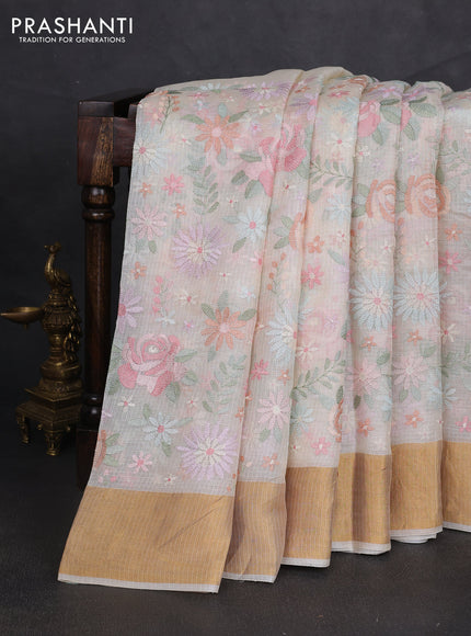 Silk kota saree cream with allover floral embroidery work and zari woven border