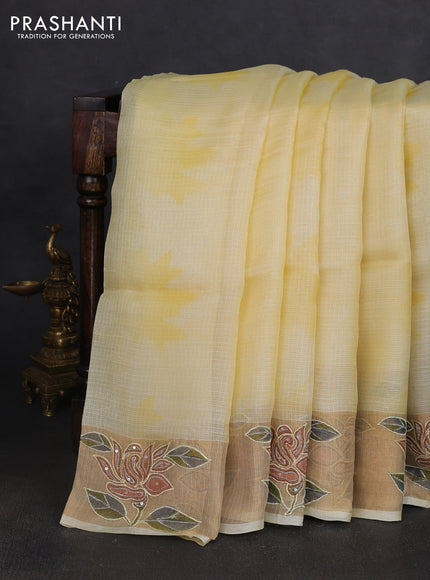 Silk kota saree pale yellow with prints and zari woven embroidery border