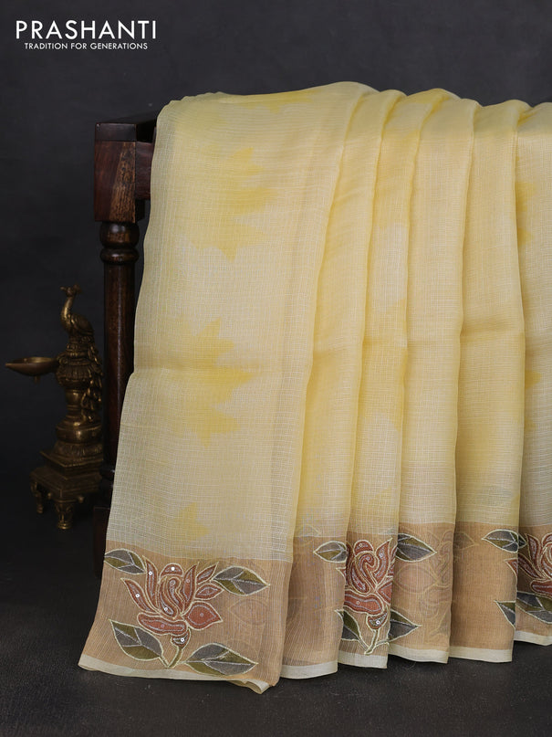 Silk kota saree pale yellow with prints and zari woven embroidery border