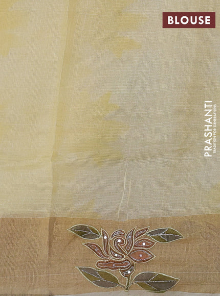Silk kota saree pale yellow with prints and zari woven embroidery border