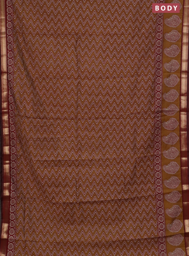 Semi maheswari cotton saree mustard yellow and deep maroon with allover zigzag prints and zari woven border