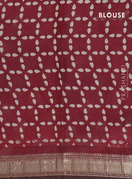 Semi maheswari cotton saree maroon with allover floral prints and zari woven border