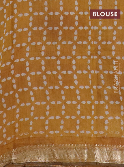 Semi maheswari cotton saree mustard yellow with allover floral prints and zari woven border
