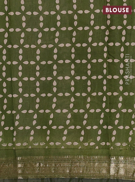 Semi maheswari cotton saree sap green with allover floral prints and zari woven border