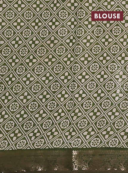Semi maheswari cotton saree sap green with allover ajrak prints and zari woven border