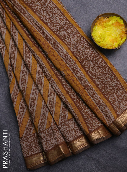 Semi maheswari cotton saree mustard yellow with allover prints and zari woven border