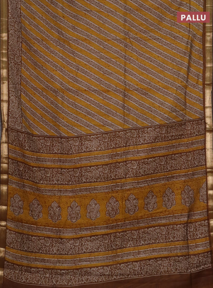 Semi maheswari cotton saree mustard yellow with allover prints and zari woven border