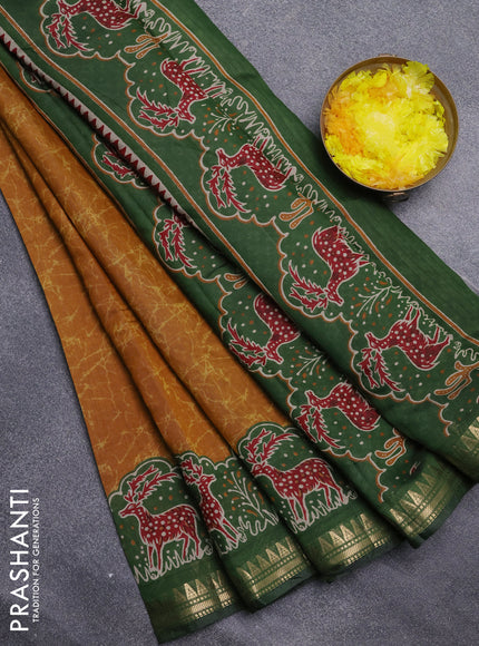 Semi maheswari cotton saree dark mustard and sap green with allover batik prints and zari woven border